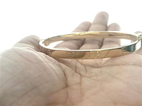 screw bangle bracelet|gold bangle bracelet with screws.